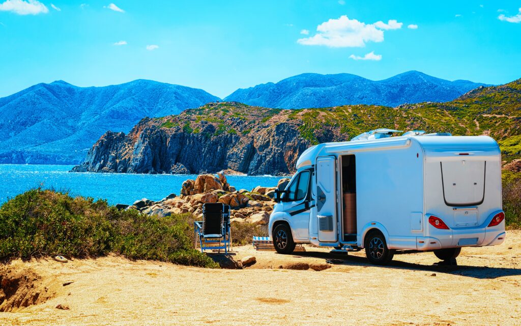 Trailer in Capo Pecora resort at Mediterranean sea Sardinia reflex